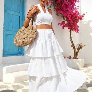 Elegant casual 2-piece white set halter neck sleeveless top and ruffle hem skirt